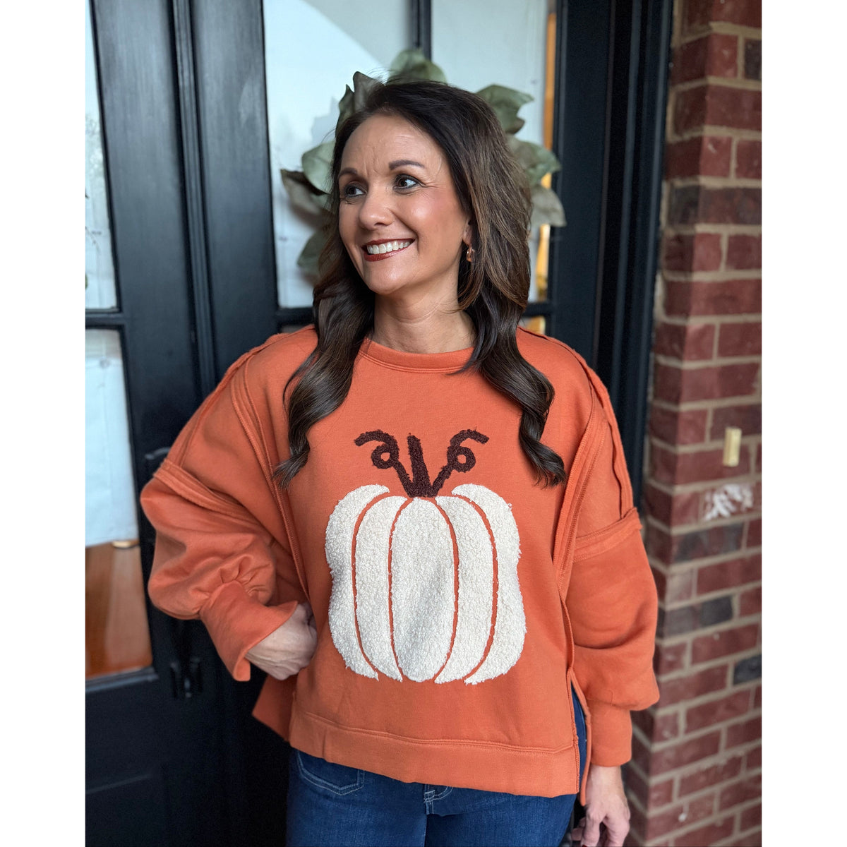 Annie Ks Boutique vintage rust pullover with a textured white pumpkin patch, featuring an oversized fit and side slits.