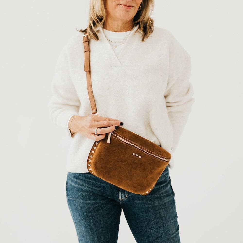 Annie Ks Boutique Sabrina camel vegan suede bum bag worn as a crossbody with gold rivet studs and zipper detail