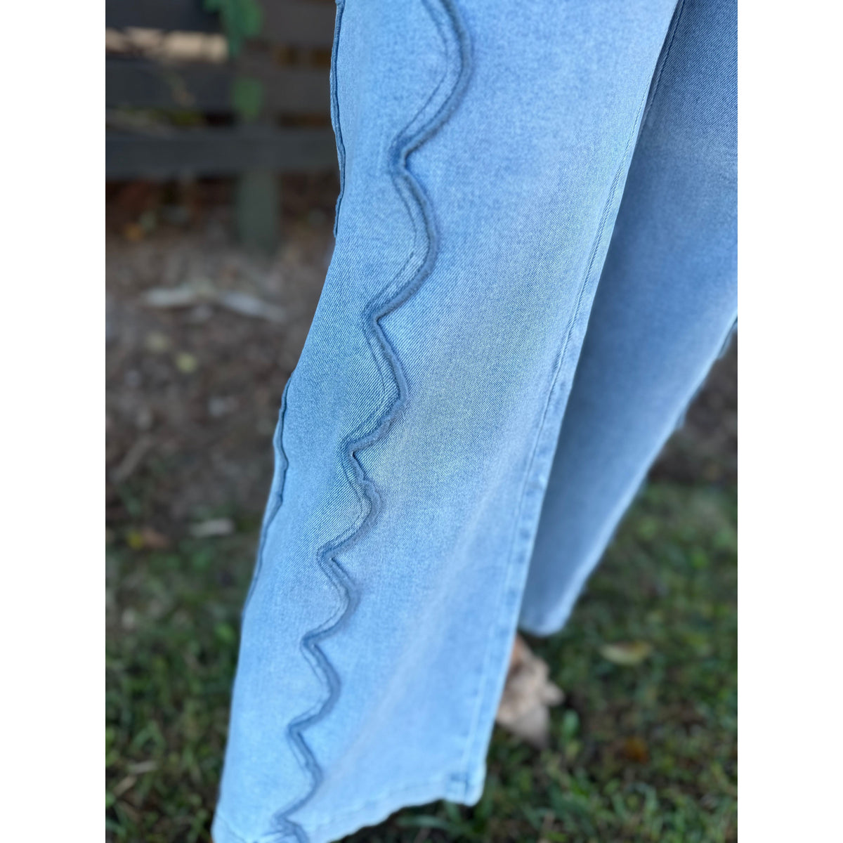 Annie Ks Boutique wide leg denim jeans in blue featuring elegant scalloped seam detailing on the side leg
