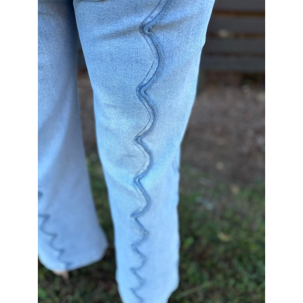 Annie Ks Boutique wide leg denim jeans in a light blue wash featuring unique vertical scalloped seam detailing