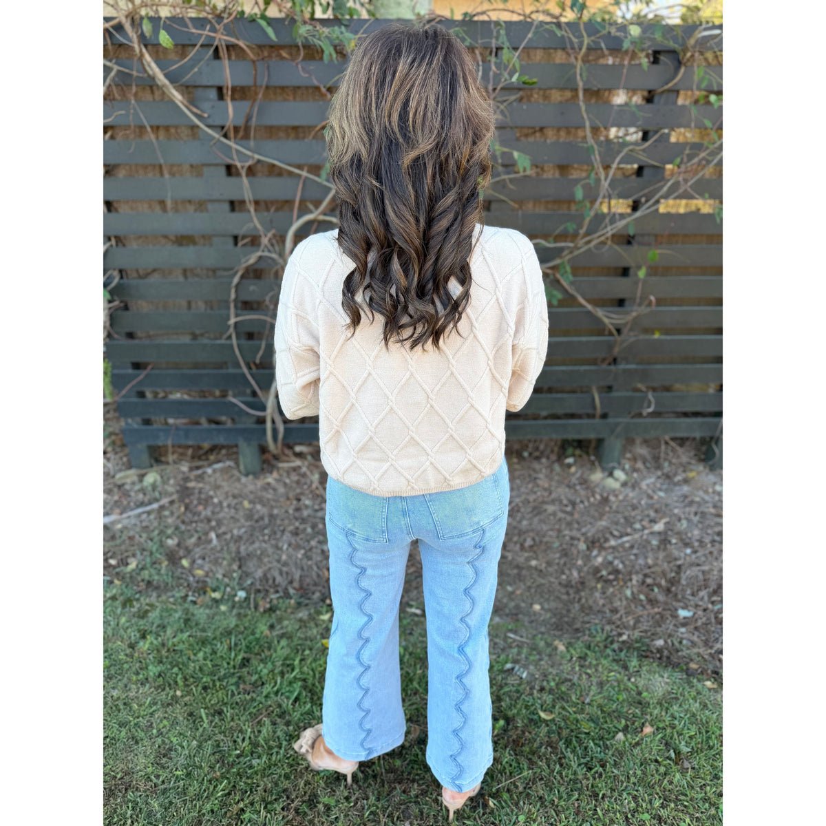 Annie Ks Boutique wide leg denim jeans featuring unique scalloped seam detailing on the back in a light blue wash