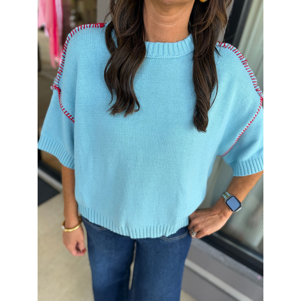 Annie Ks Boutique sky blue short sleeve sweater with red blanket stitch detail and ribbed round neckline