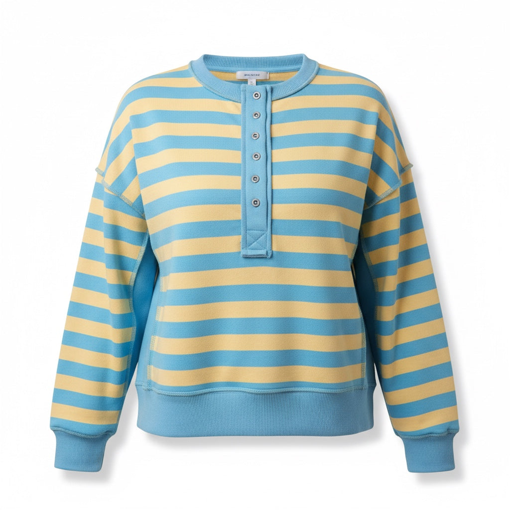 Annie Ks Boutique oversized yellow and blue striped knit top with a half-button front and raw-edge sleeve details.