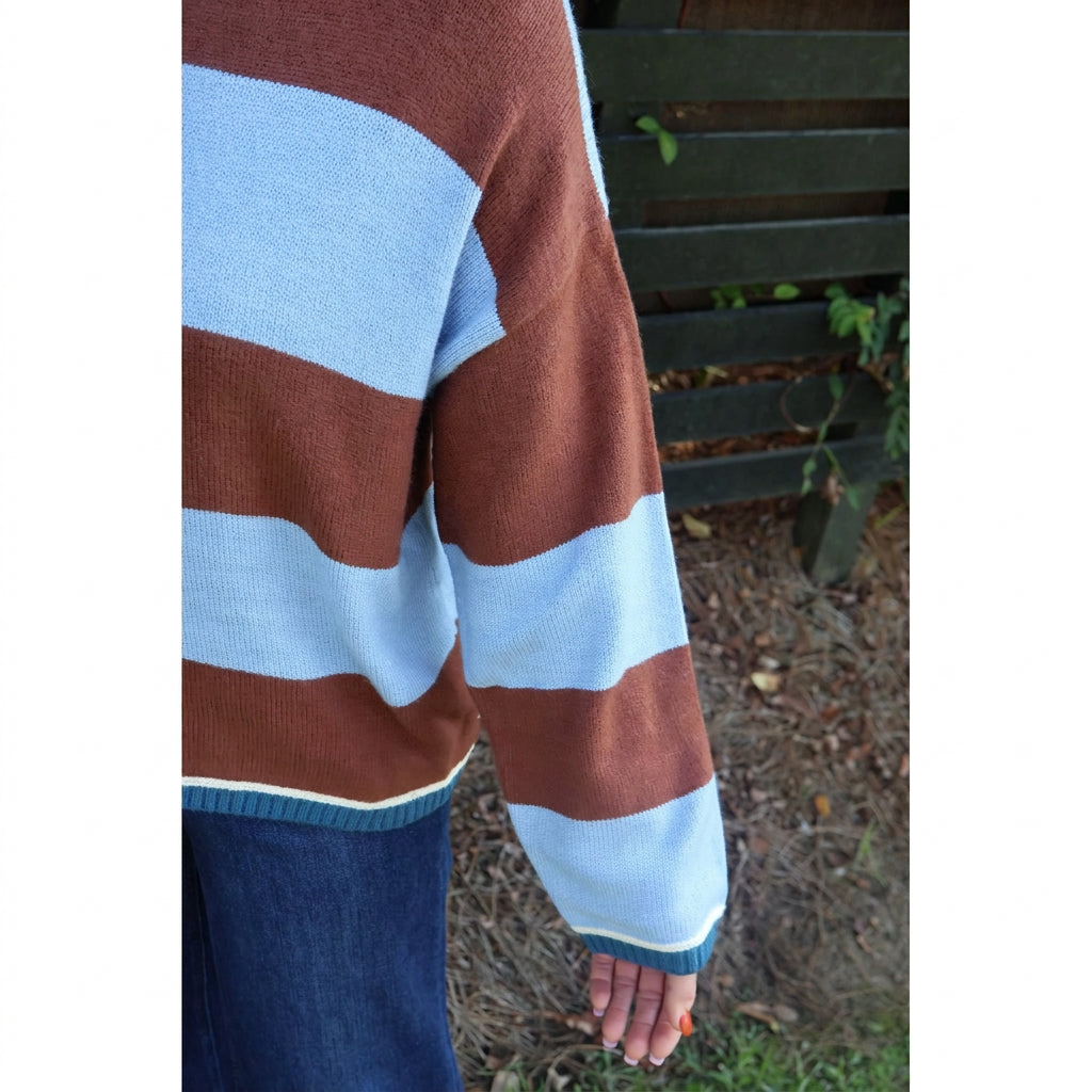 Annie Ks Boutique blue and brown wide stripe knit sweater with ribbed trim worn with dark denim jeans