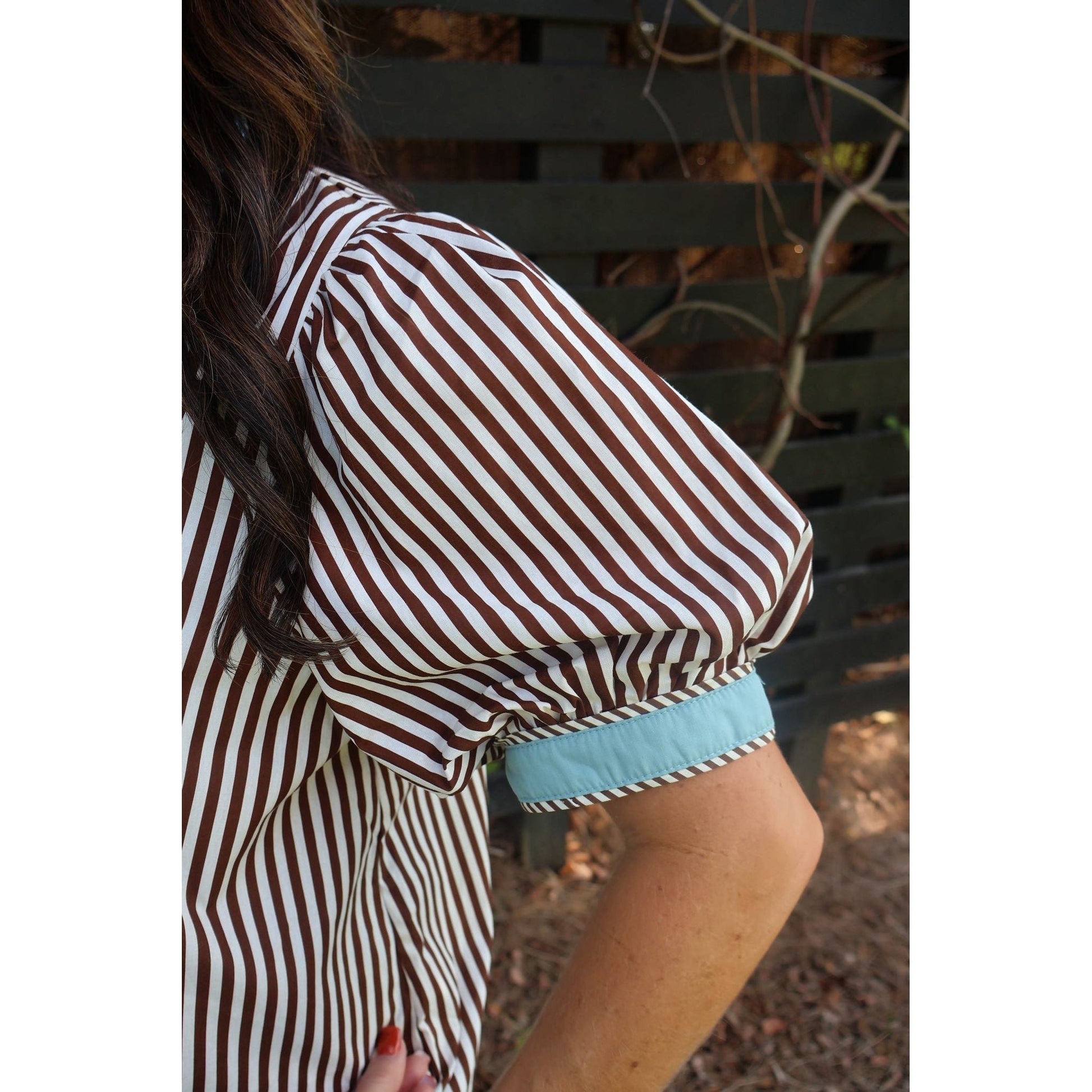 Annie Ks Boutique brown and cream striped cotton top featuring short puff sleeves with a contrasting blue cuff detail