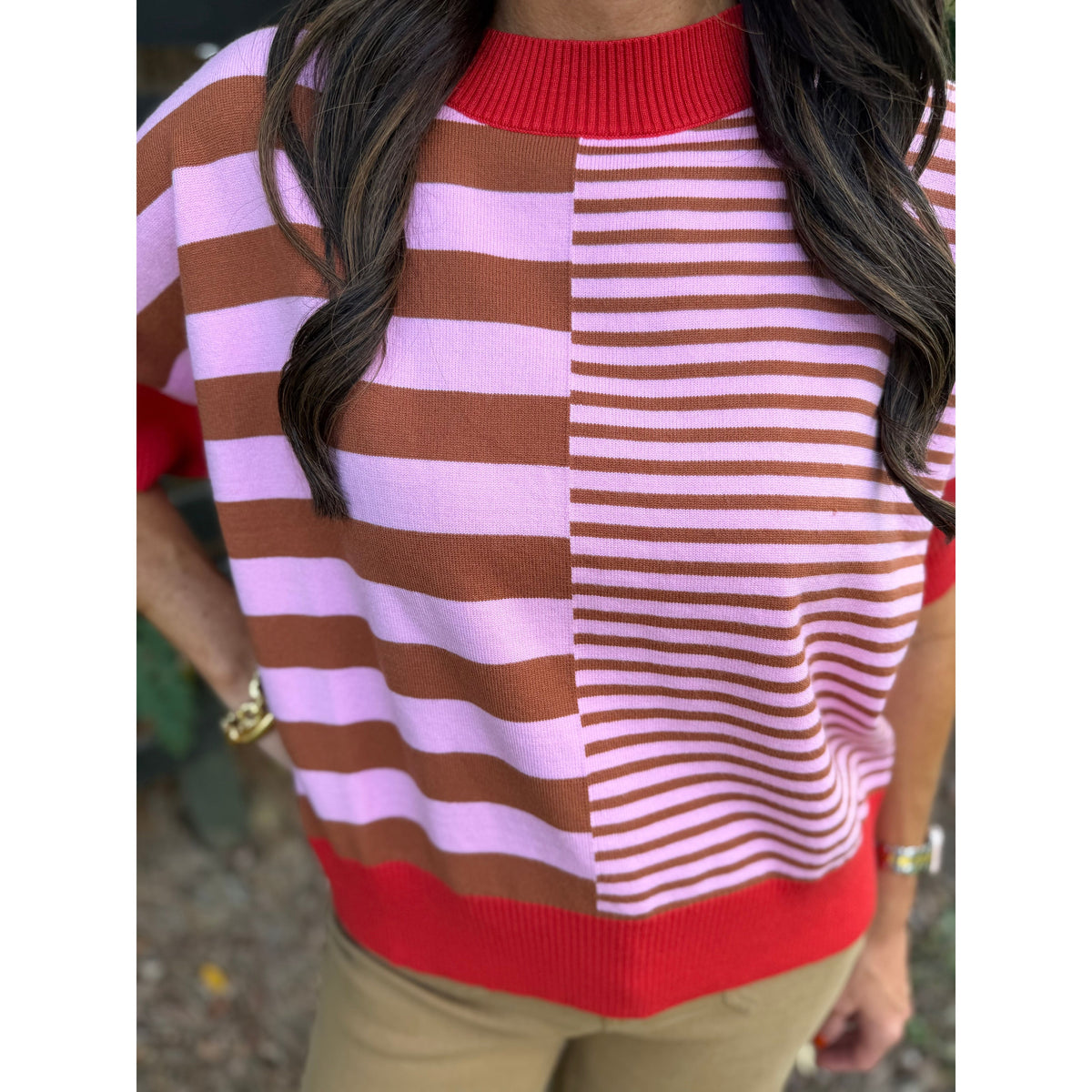 Annie Ks Boutique rust and caramel striped drop-shoulder sweater with a mock neck and mixed stripe pattern
