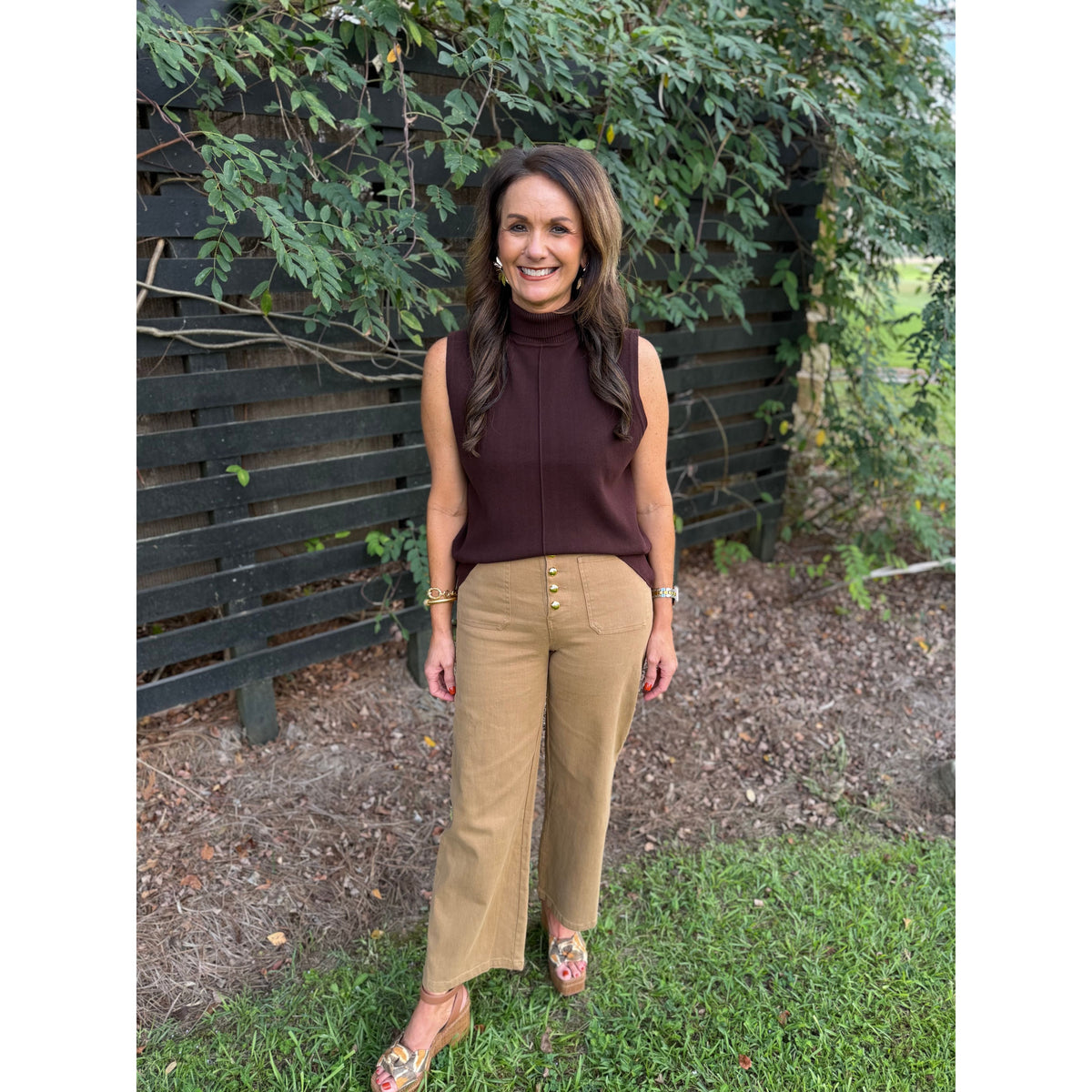 Annie Ks Boutique Hudson tan wide-leg trousers with front button detail worn by a woman with a brown sleeveless top.