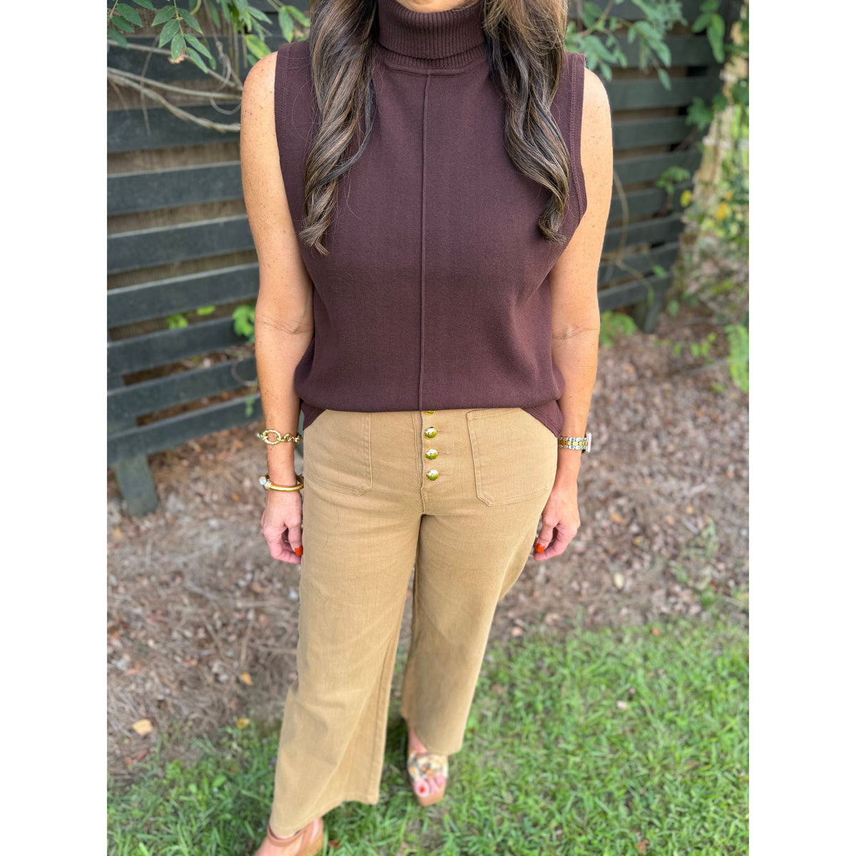 Annie Ks Boutique Hudson tan wide-leg trousers with front button detail paired with a brown sleeveless turtleneck