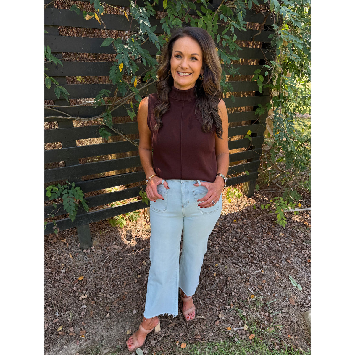 Annie Ks Boutique high-rise wide-leg cropped jeans in Blizzard Blue with a raw hem, worn with a brown sleeveless top.