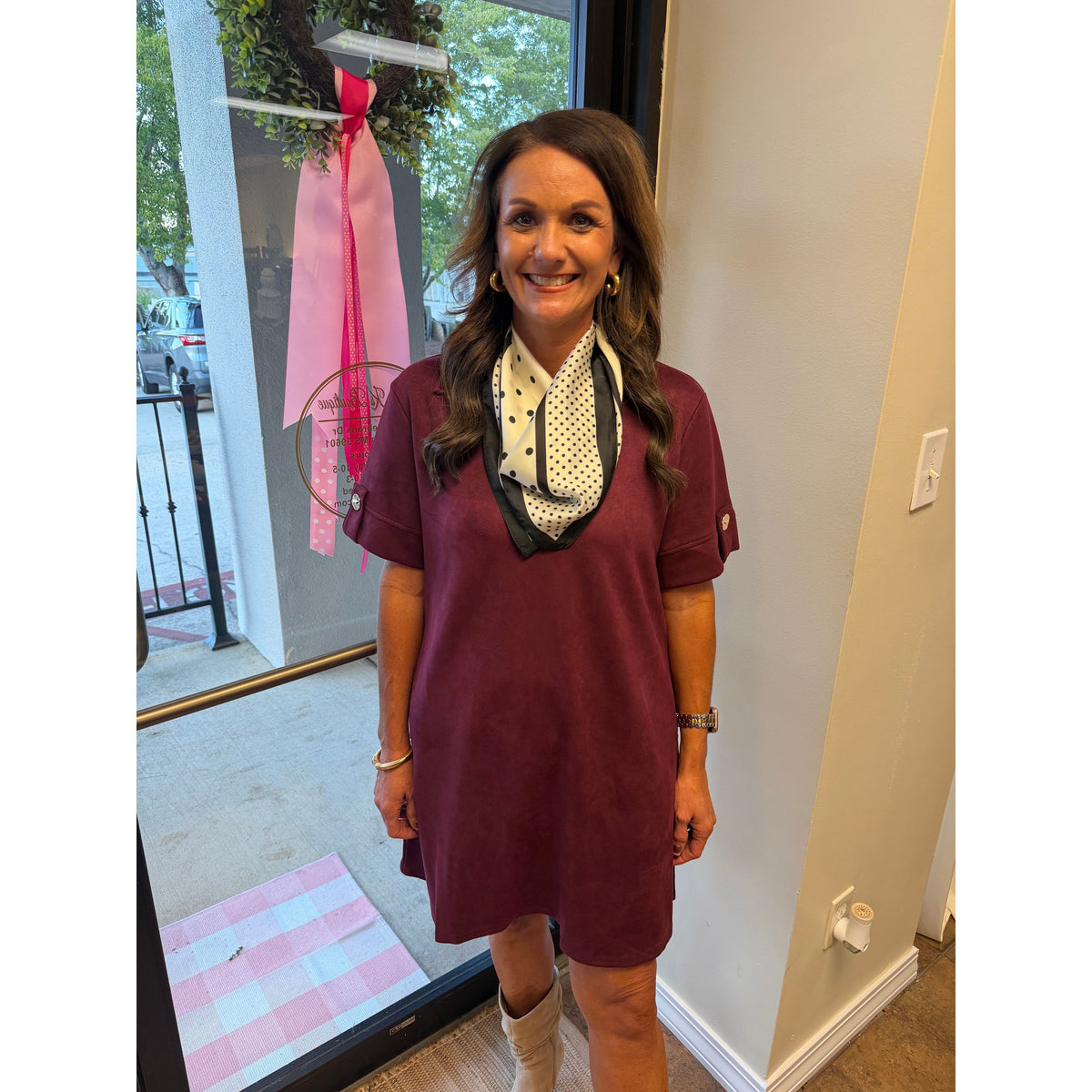 Annie Ks Boutique wine faux suede mini dress with a collared neckline and short sleeves worn with a polka dot scarf